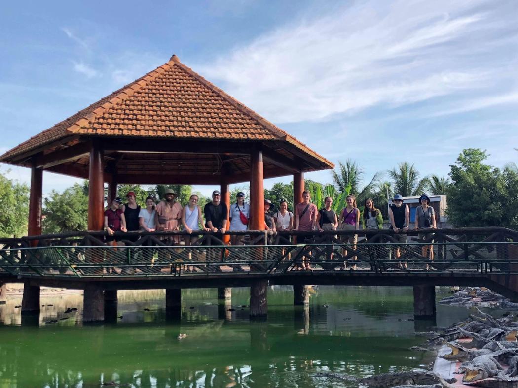 Students pose for a picture during a field study in Vietnam.