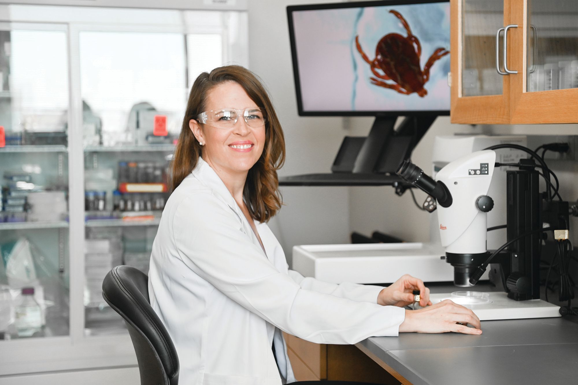 Emily Owens Pickle, a graduate of the Rollins MPH program and an assistant professor at Old Dominion, poses for a photo in her lab.