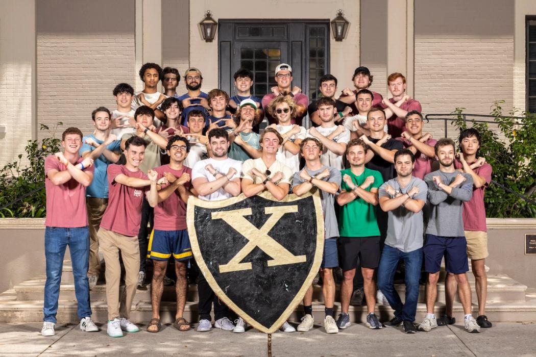 X-Club Fraternity brothers standing in front of their residence on Rollins campus.