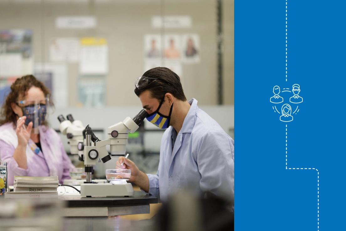 Colin Kelly ’19 ’21MBA and one of his mentors, biology professor Fiona Harper, using microscopes in the lab.