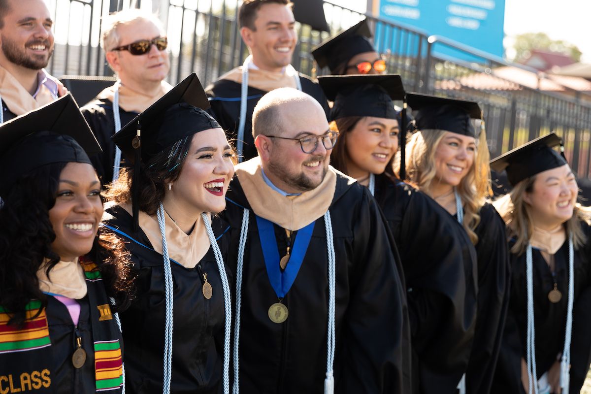 A group of students at Commencement for Crummer School of Business