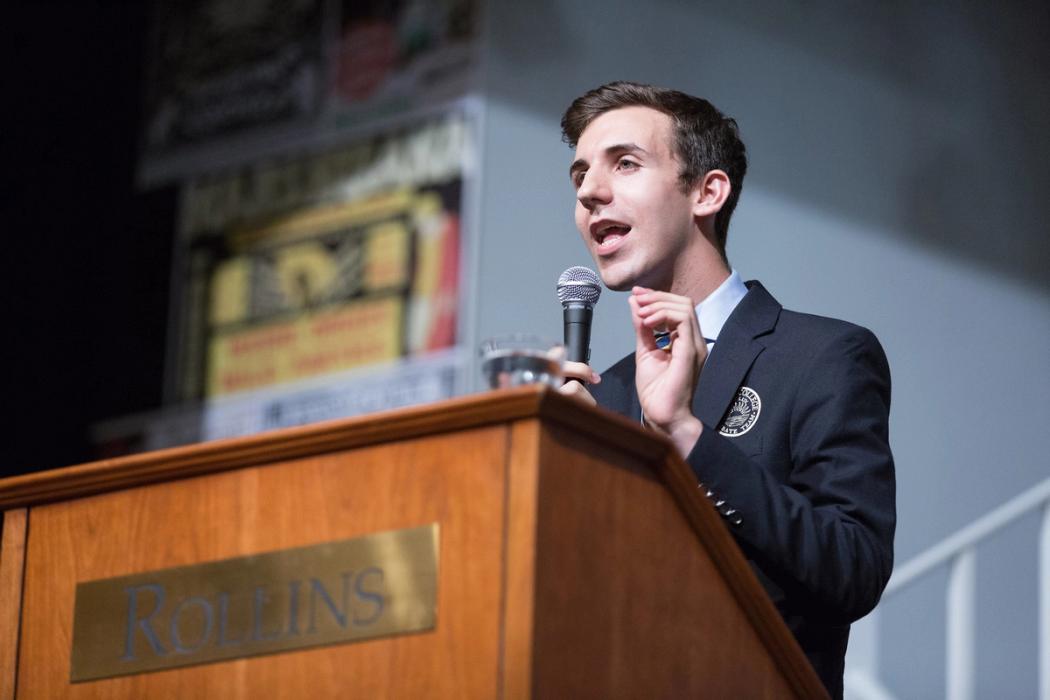 Student debates from podium.