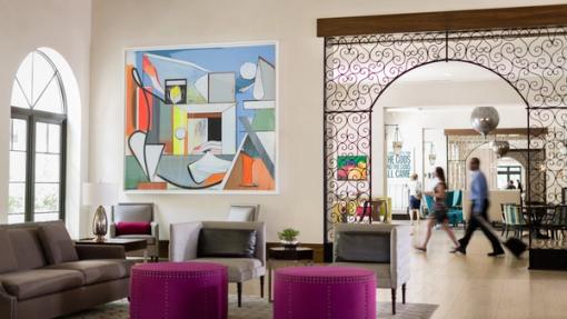 Two guests walk through The Alfond Inn lobby.