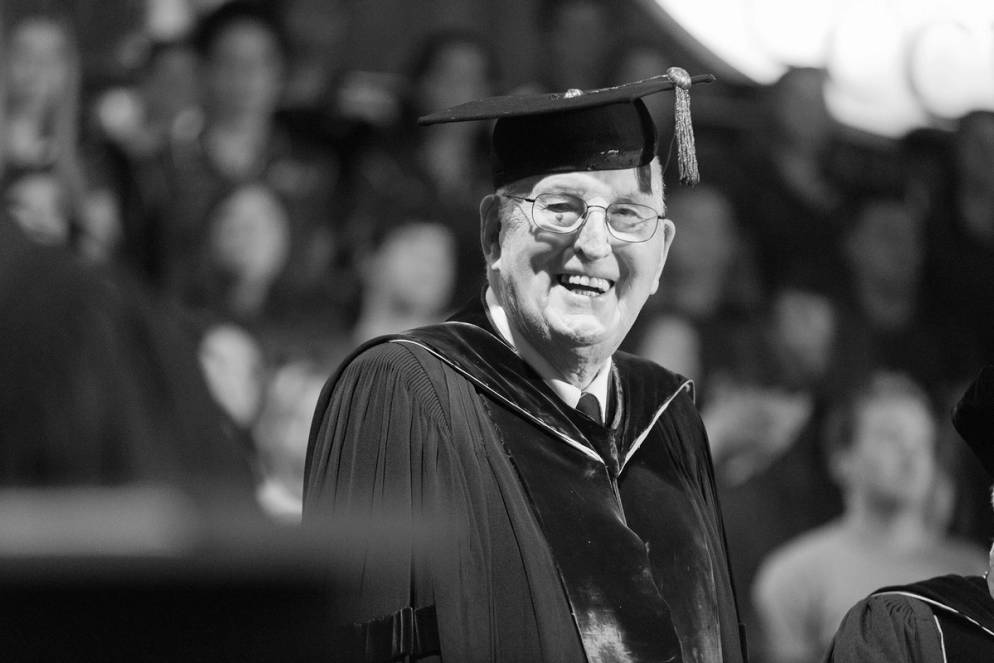 Thad Seymour pictured in graduation regalia for one of Rollins’ commencement ceremony.