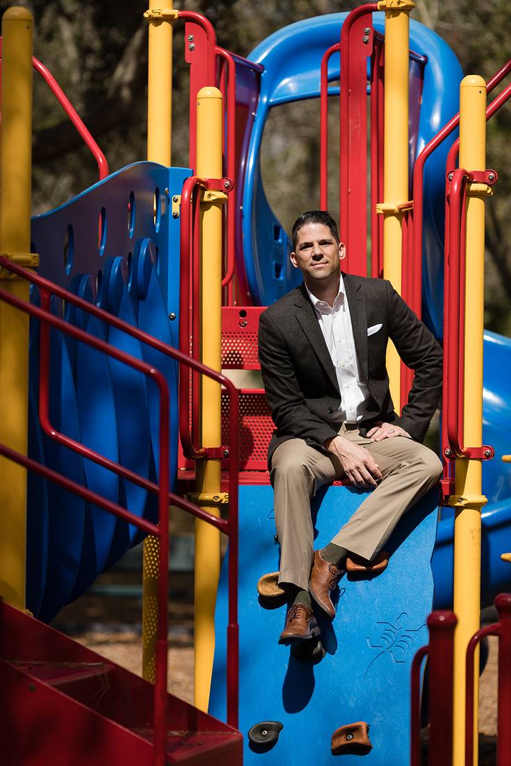 Neil Otto ’05 pictured on a colorful playground near Rollins’ campus.