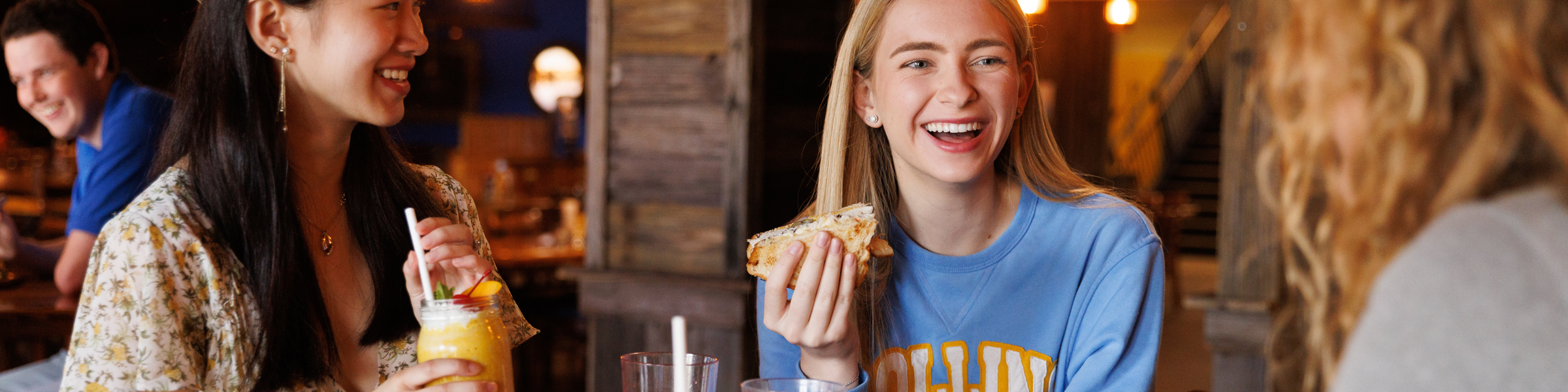 A group of Rollins College students dining on campus.