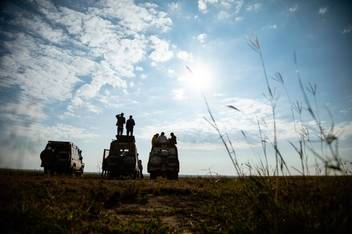 Students standing on Jeeps on safari in Tanzania during a study-abroad experience.