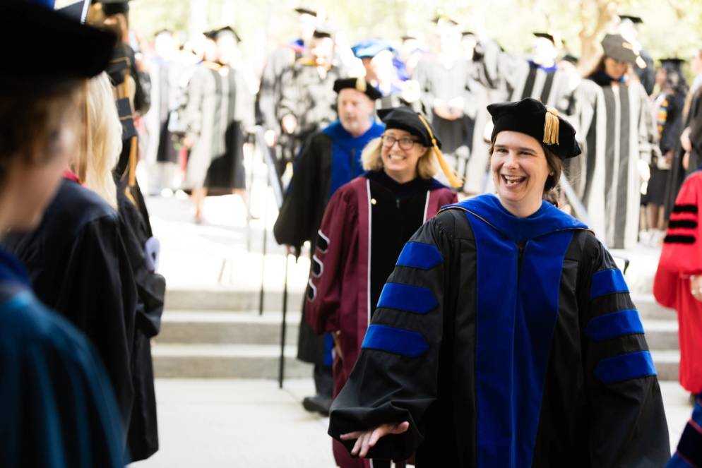 Professors enter the auditorium.