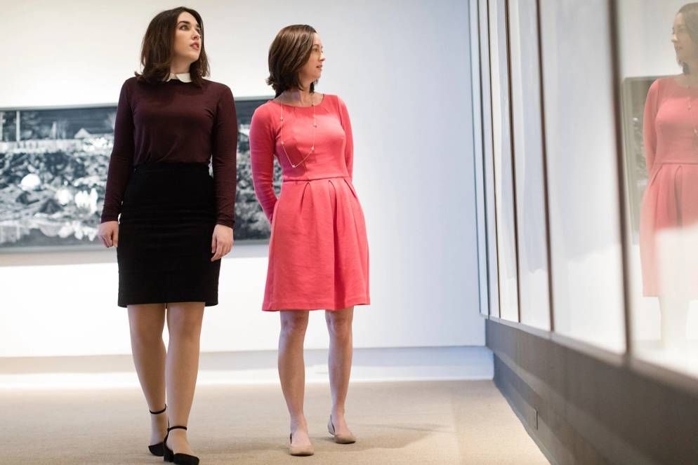 A professor and student discuss artwork in the Rollins fine arts museum.