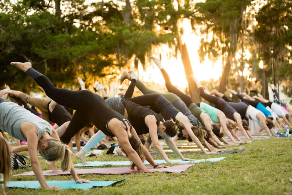 Students doing yoga on Mills Lawn.