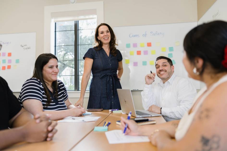 A group of students gather on campus.