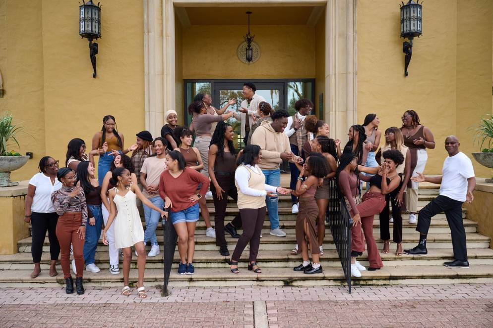 Members of the Rollins Black Student Union gather on the steps of Kathleen W. Rollins Hall