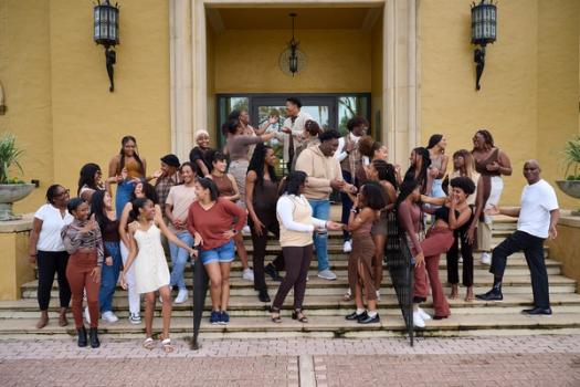 The Black Student Union poses for a group photo in front of Kathleen W. Rollins Hall.