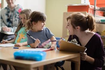 Psychology student works with a child in Rollins’ Child Development Center.