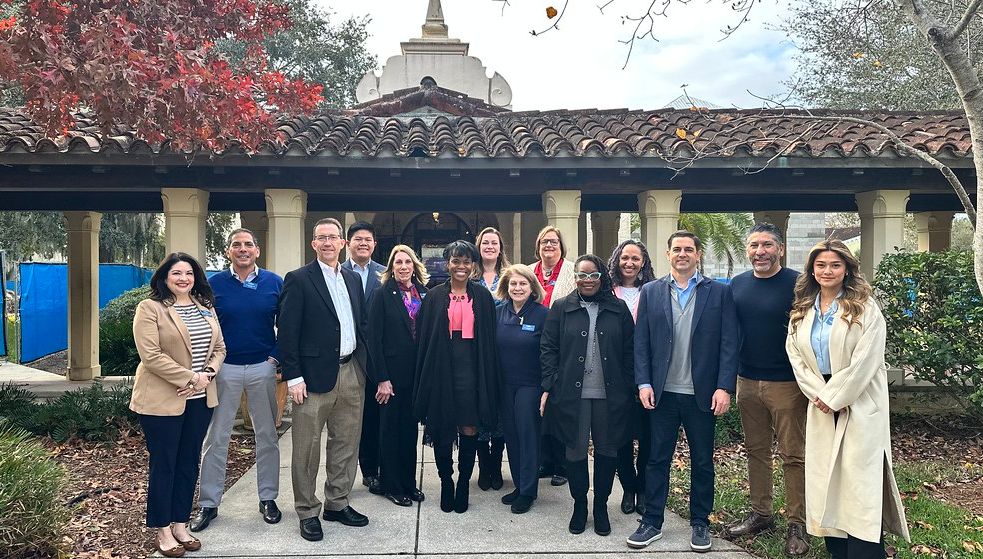 Group photo of alumni advisory board members on campus.