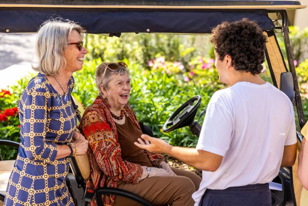 Polly Seymour talks to a student and Peg Cornwell.