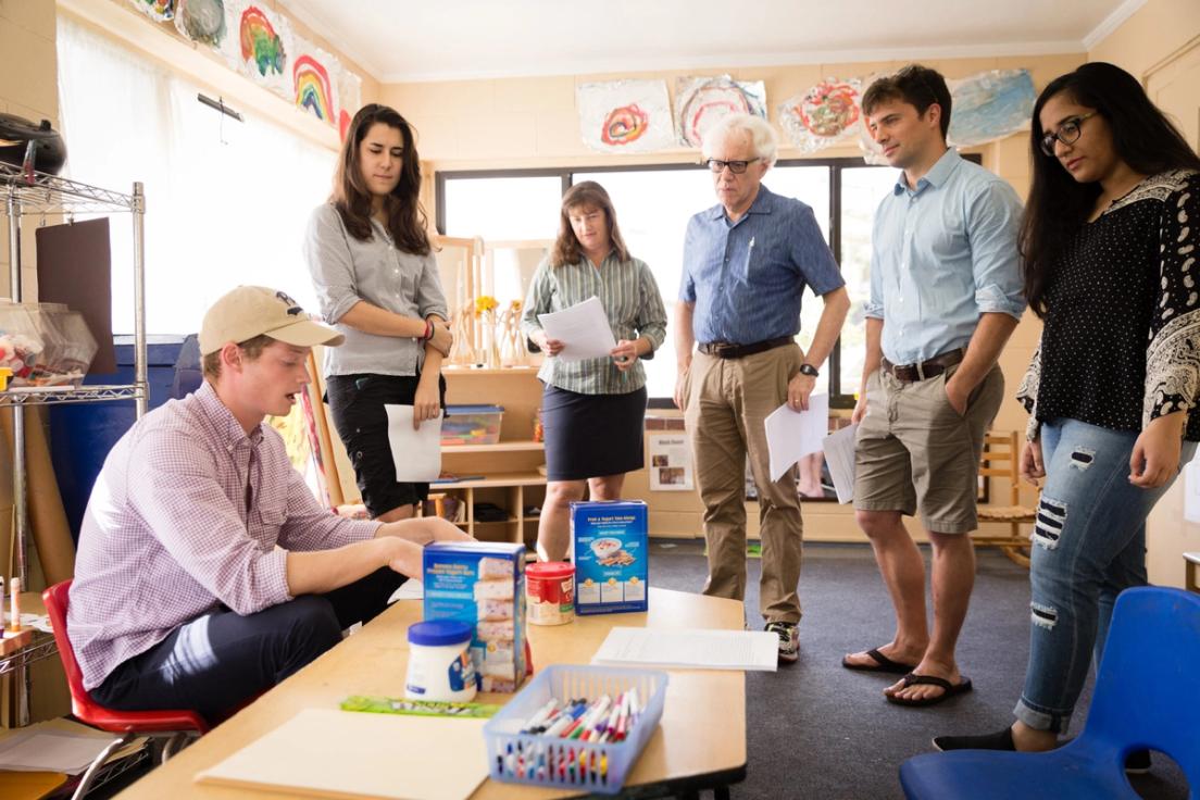 A philosophy student sits and prepares a hands-on exercise.