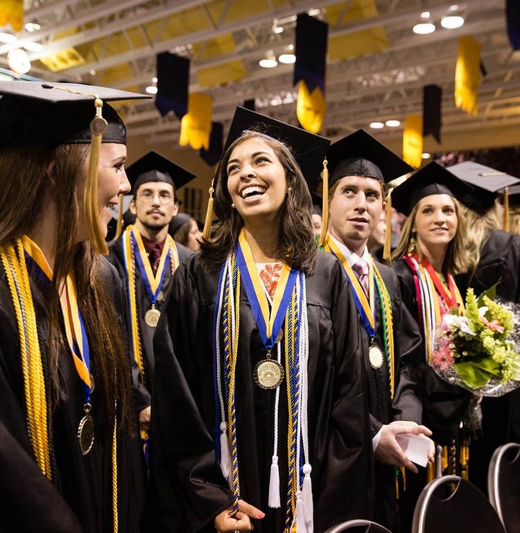 Students in cap and gown at commencement ceremony