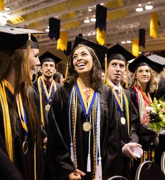 Students in cap and gown at commencement ceremony