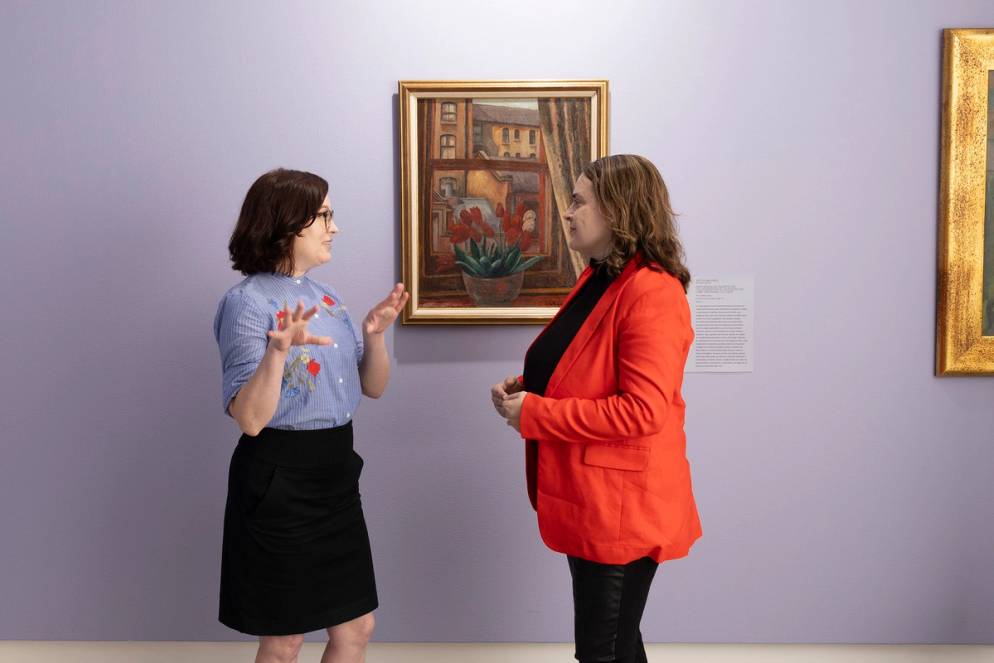Leslie Anderson meets with a museum staffer to discuss collections