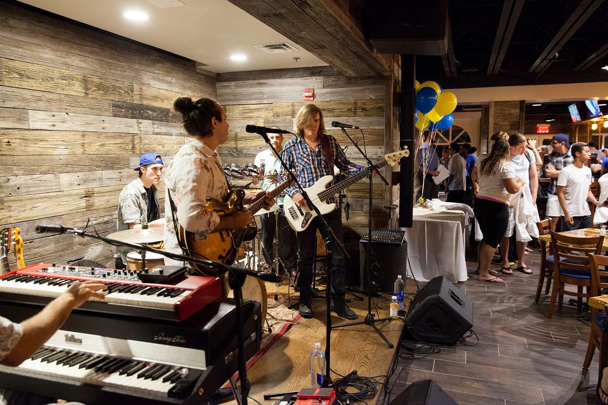 Band performs on opening night of Dave’s Boathouse on campus.
