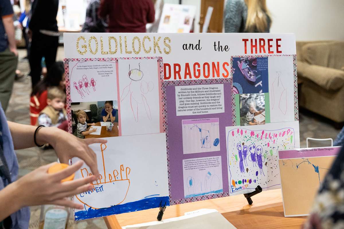 A poster board presentation that reads Goldilocks and the Three Dragons.