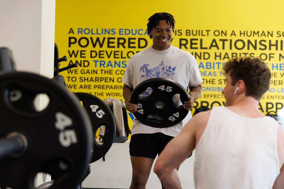 A student working out in the gym at Lakeside Neighborhood.