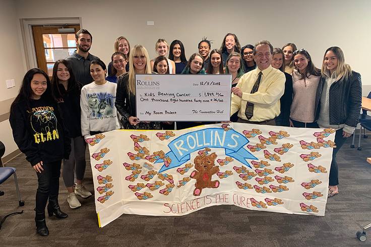 Communication professor David Painter and his students raised money for families of children undergoing transplant treatments.