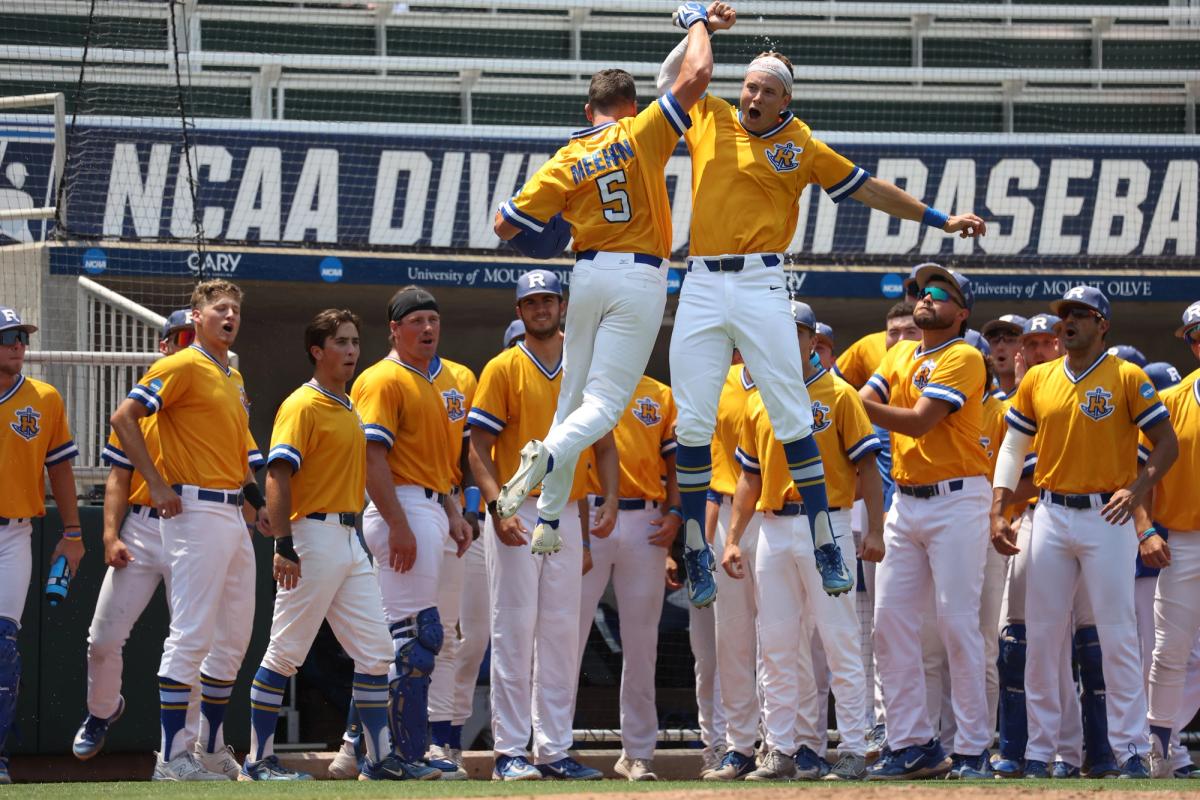 Rollins baseball team with two players leaping into a high-five.