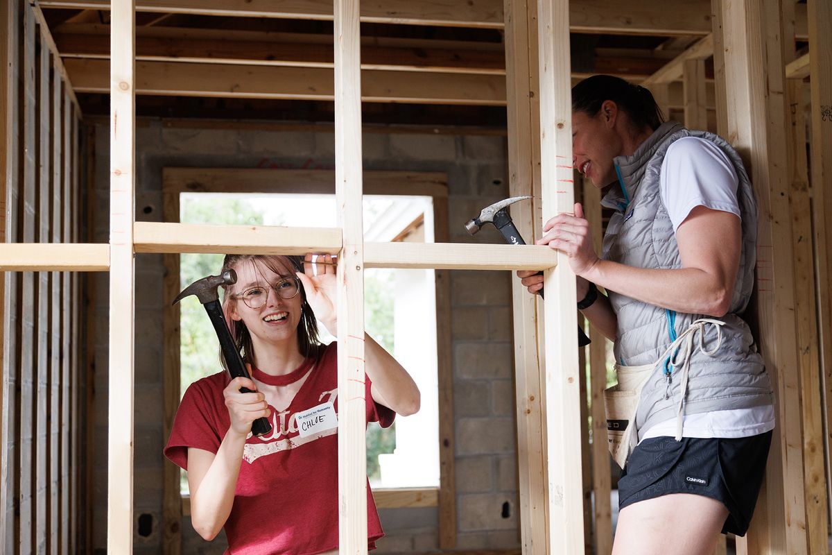 Rollins students hammering nails on a Habitat for Humanity build.