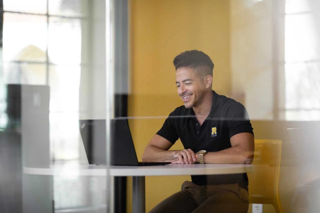 A counselor meeting with a student via video chat.