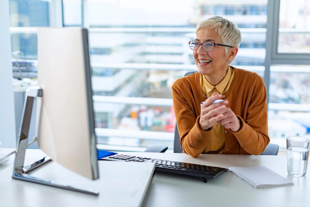 A pharmacy manager video chats with a supplier.