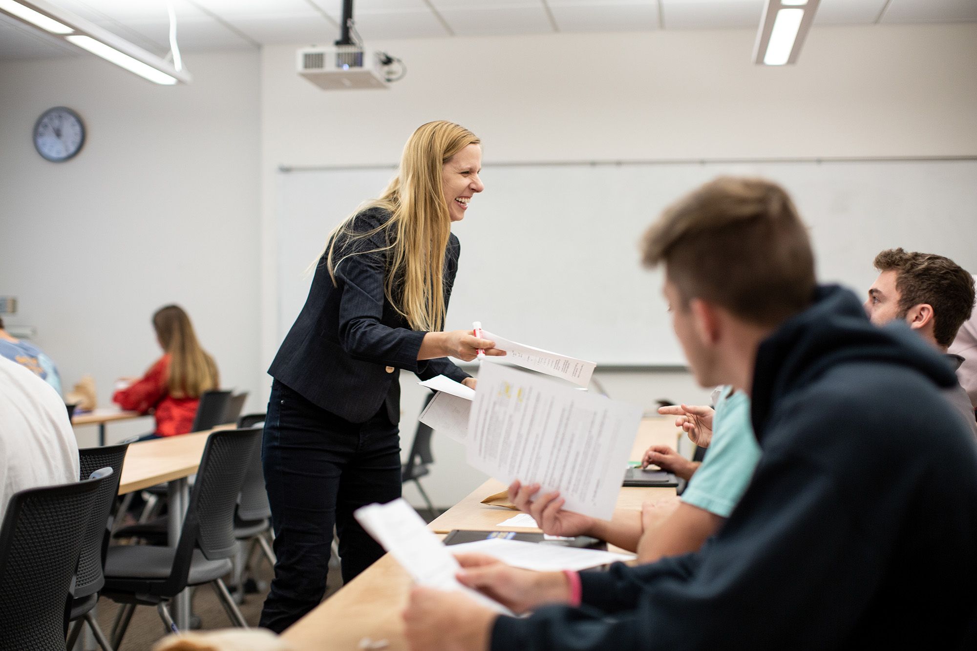 Social entrepreneurship professor Tonia Warnecke discusses sustainability in class with her students.