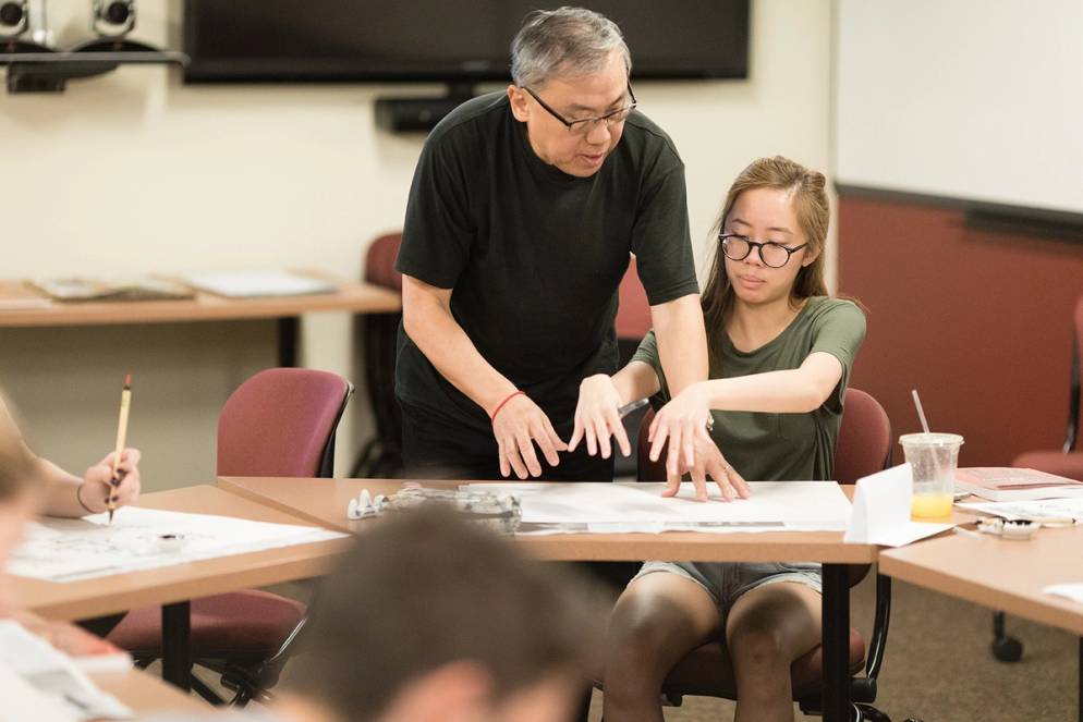 A Chinese calligraphy class in progress.