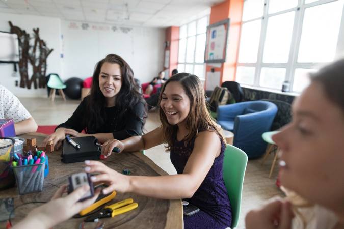 Students working with their upcycled battery for which they won the prestigious Hult Prize.