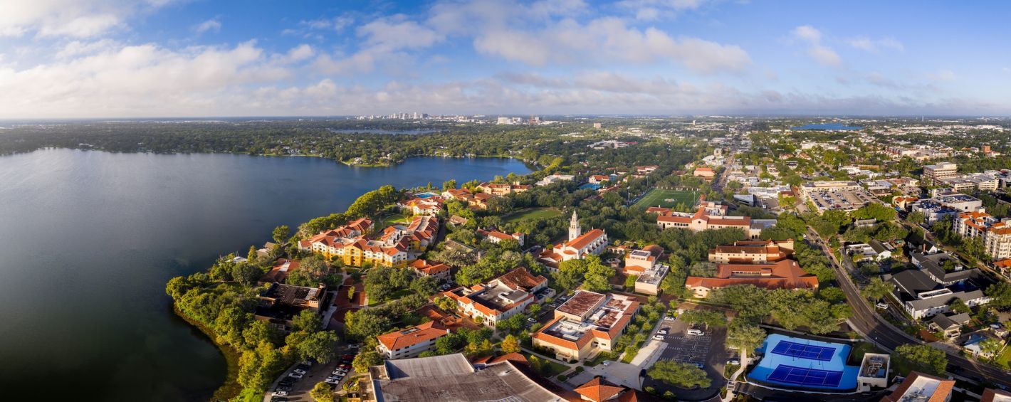 Aerial panorama of Rollins lakeside campus and surrounding urban landscape