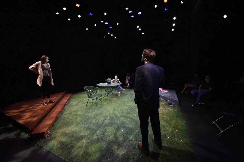 Students perform in masks in a socially distanced theater production at the Annie Russell Theatre.