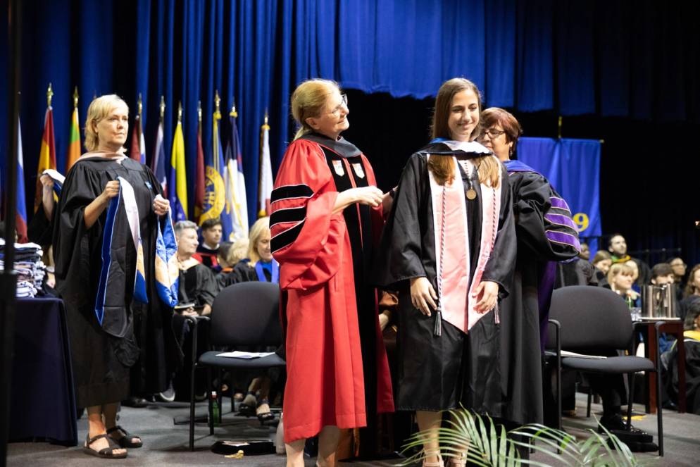 A student receives a medal.