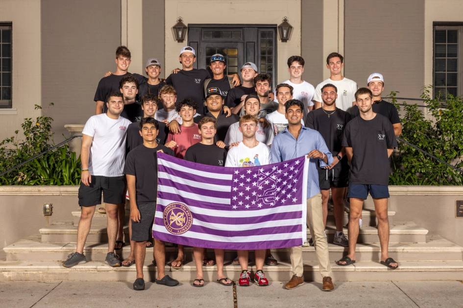 Chi Psi brothers outside their residential building at Rollins College.