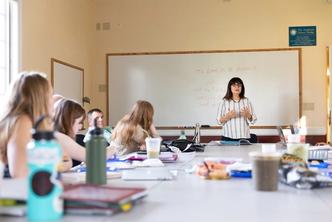 Religious studies professor leads a small discussion-based class at Rollins.