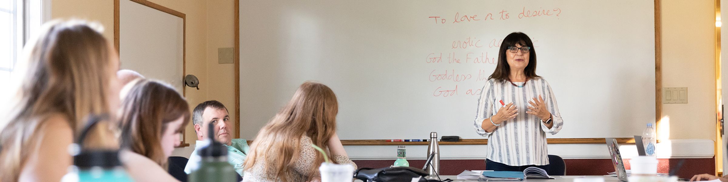 Religious studies professor leads a small discussion-based class at Rollins.