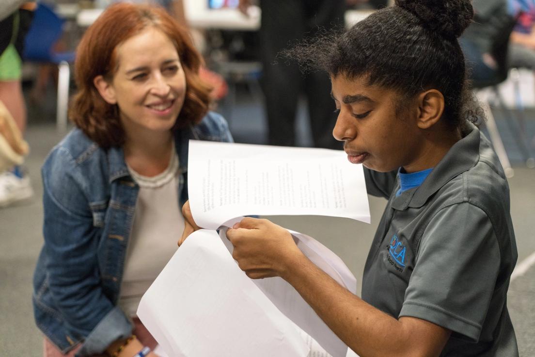 Theatre professor working with autistic child in a Rollins community engagement class