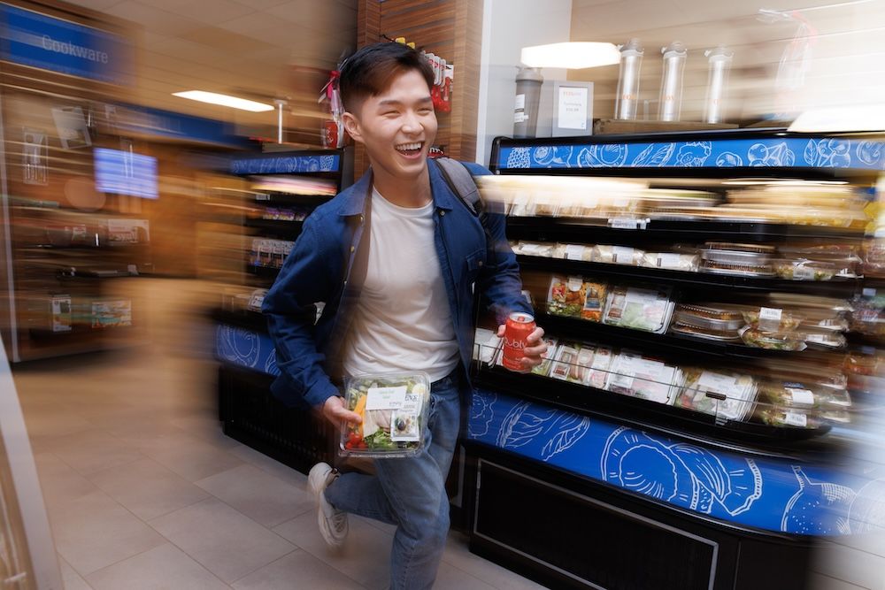 A student runs through the campus market at Rollins.