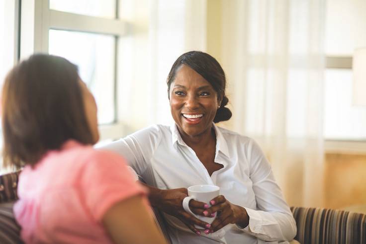 A clinical mental health counselor meets with a client.