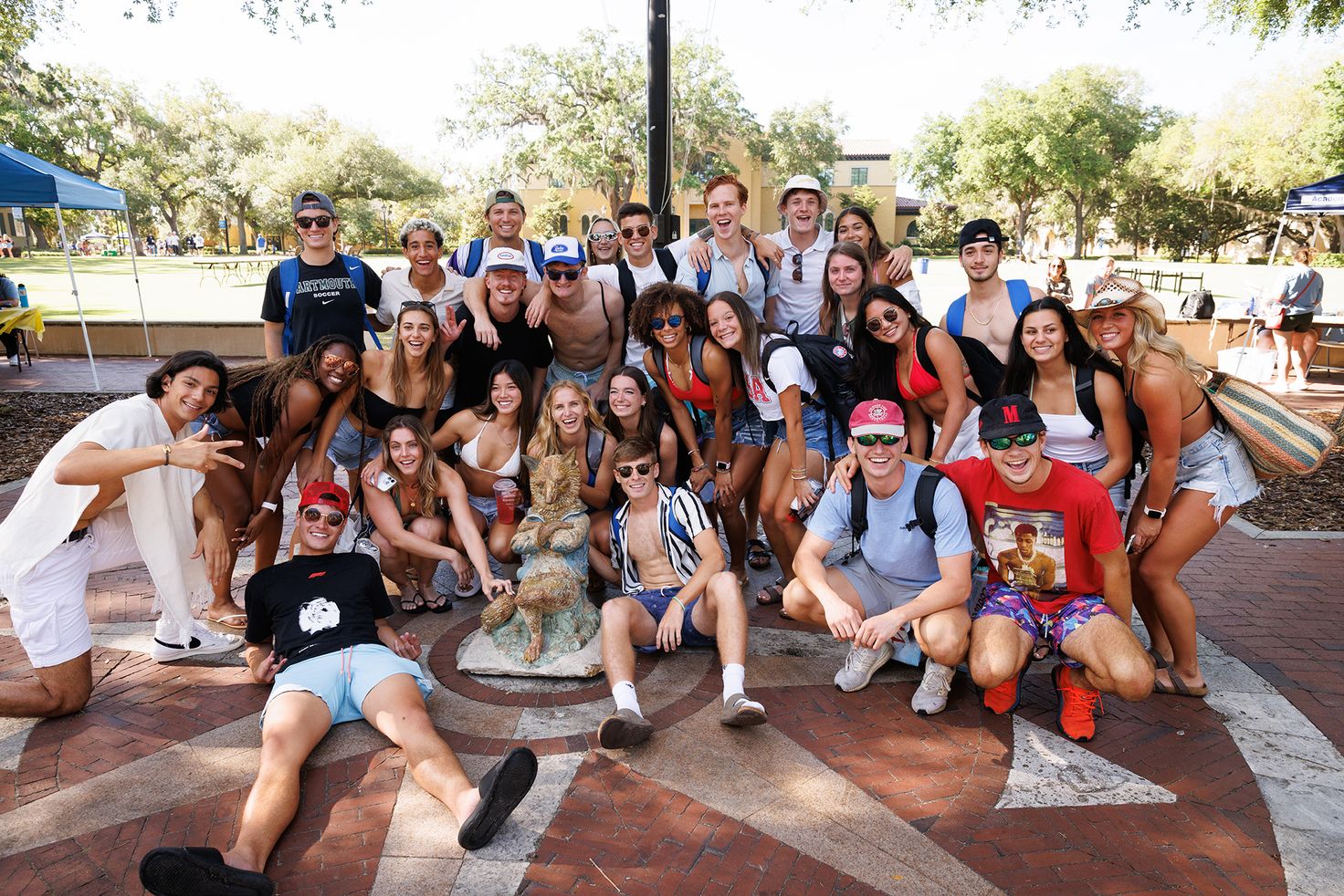 Students pose in front of the Fox Statue on Tars Plaza on Fox Day 2024