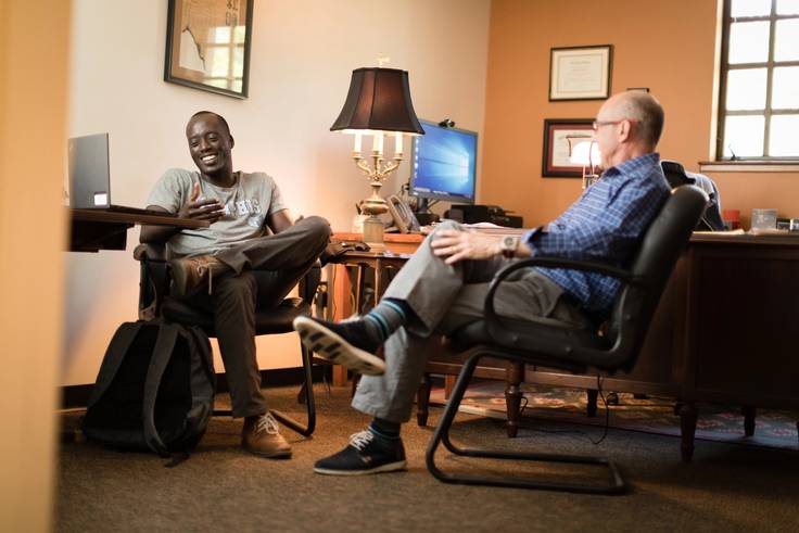 Isaac James sits with Don Davison.