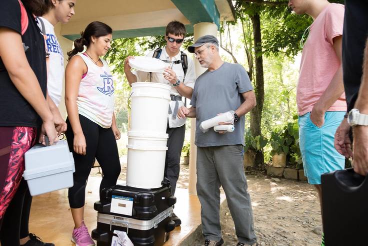Students and chemistry professor install water filters in the Dominican Republic.