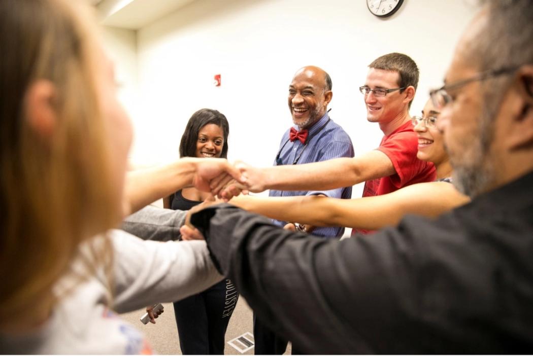 Team huddle, all hands in