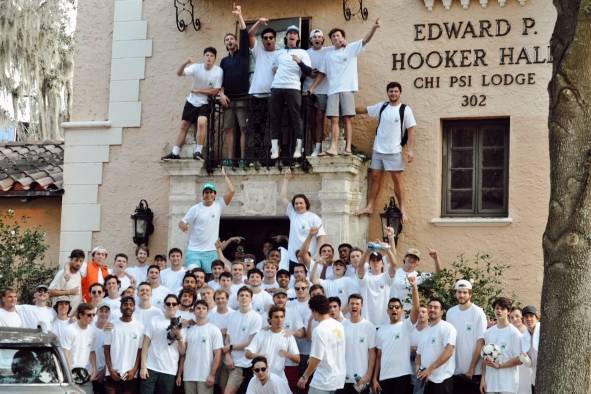 Chi Psi brothers outside their residential building at Rollins College.