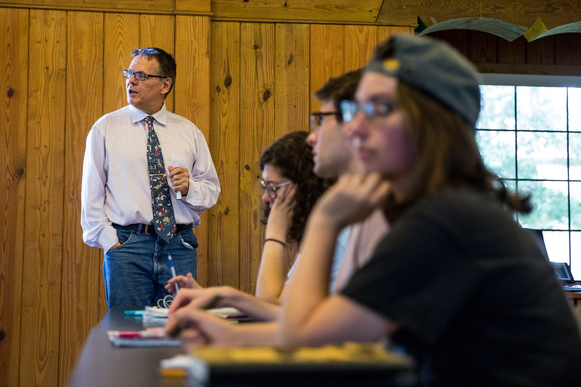 Rollins professor speaking to a class of students.